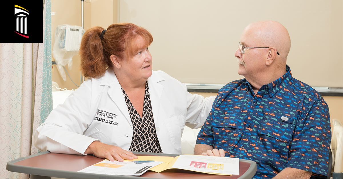 Photo of case manager guiding patient through medical documentation